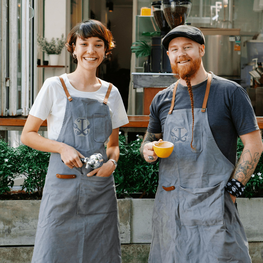 two Baristas in aprons